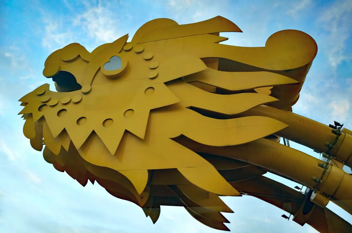 Close view of the golden dragon head on the bridge under blue sky