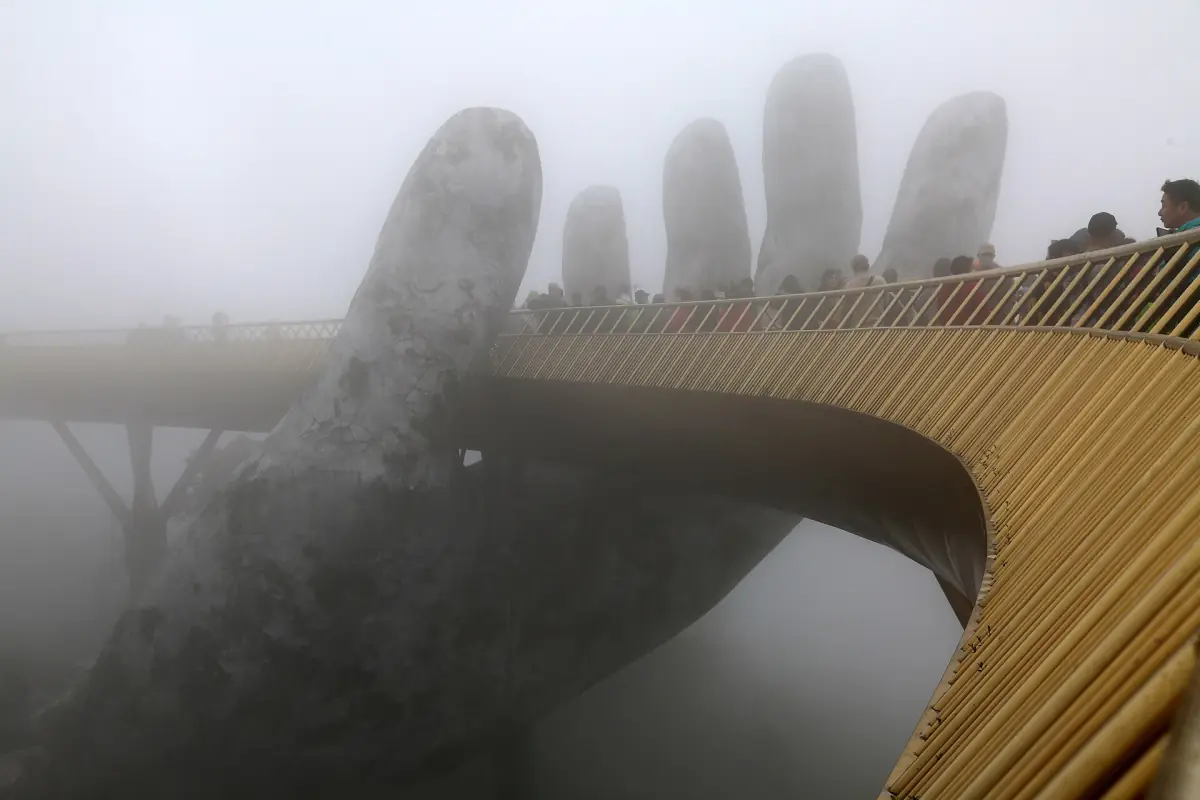 Stone hands and the golden bridge fading into thick mountain mist