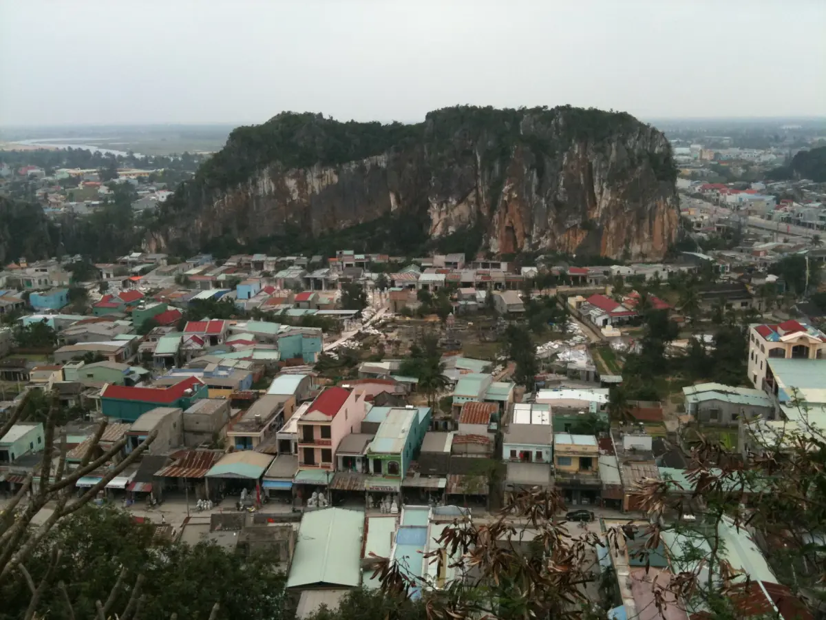 Limestone hill rising above the rooftops of the surrounding district